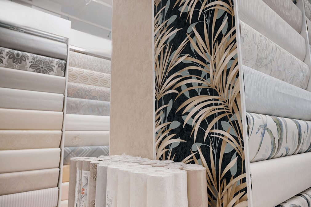 Wallpaper rolls with various patterns displayed.